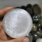 Natural selenite round moon and star pattern